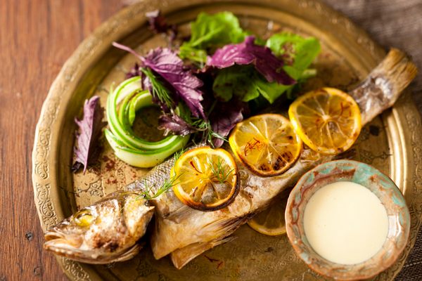 Walnut-stuffed sea bass comes with a saffron and rose water dressing